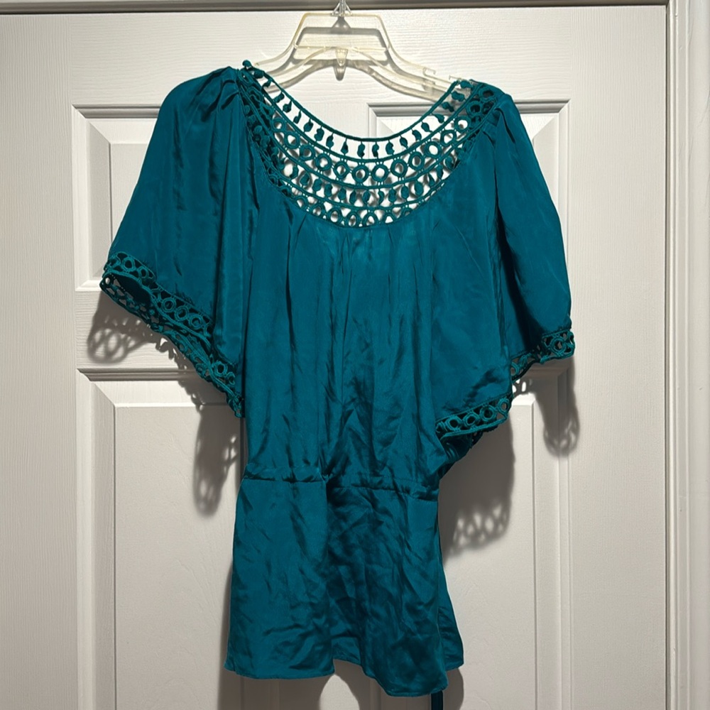 Emerald green silk top droop in the back knit in the front.